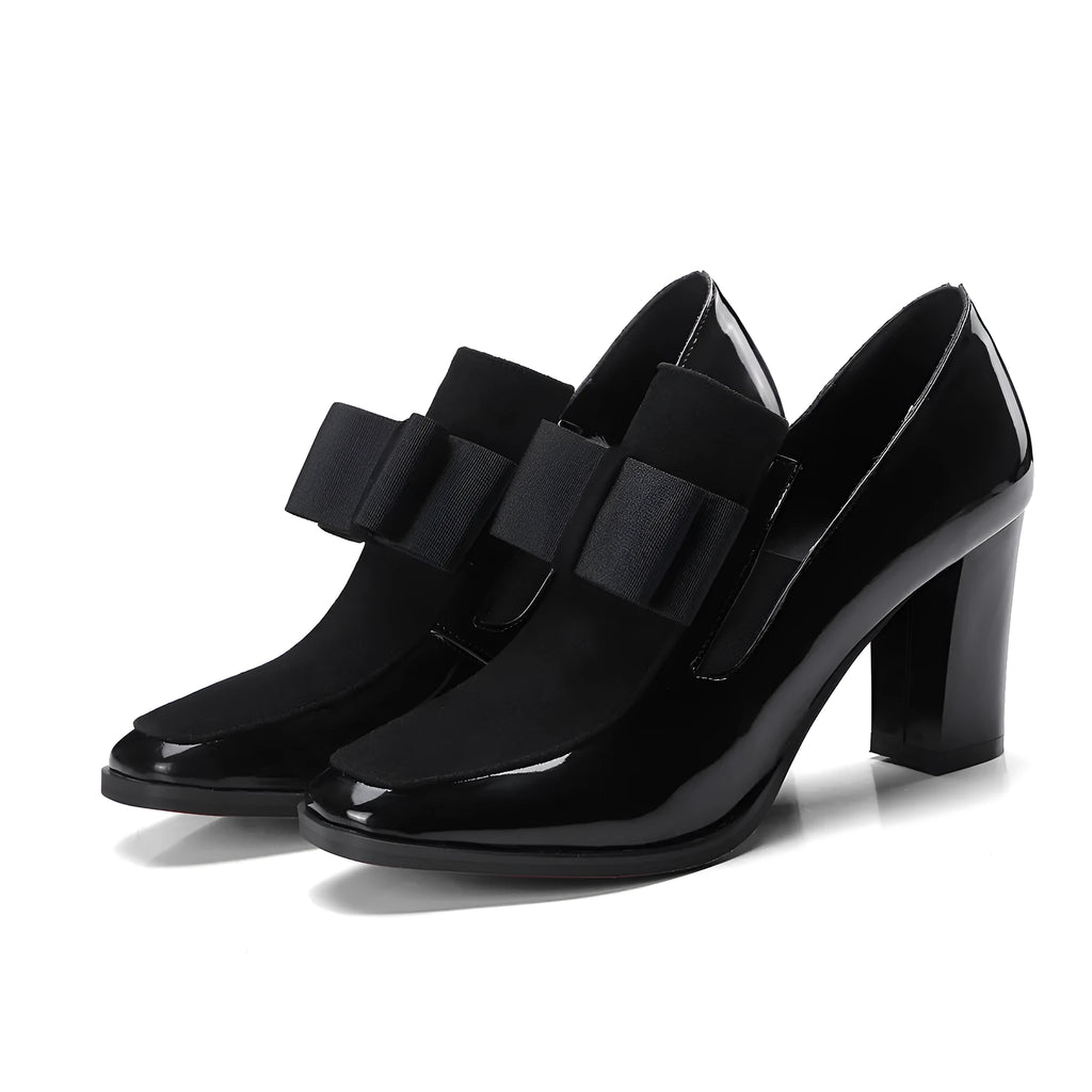 Women's black patent leather high heels with a thick square heel and square toe.