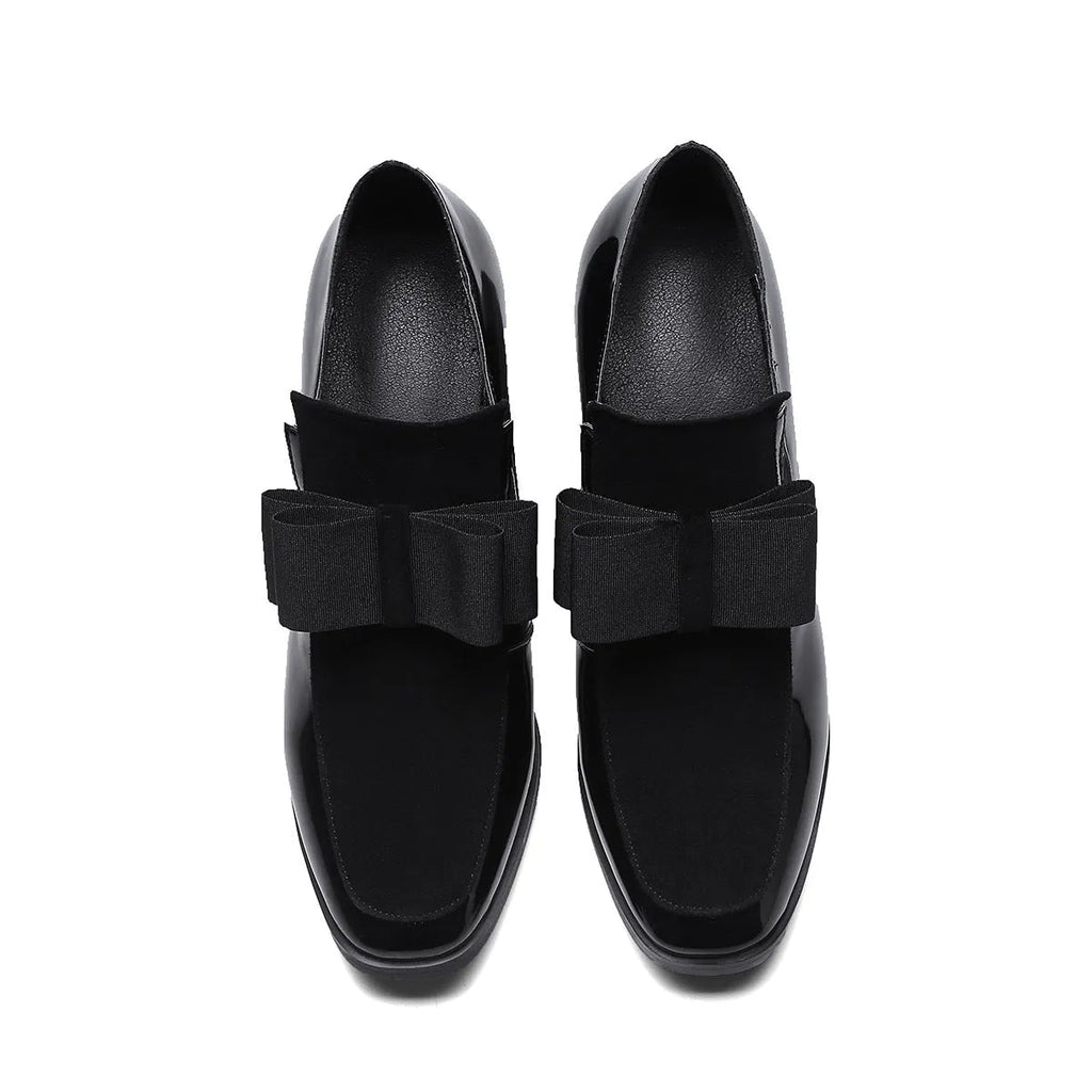 Women's black patent leather high heels with a thick square heel and square toe.