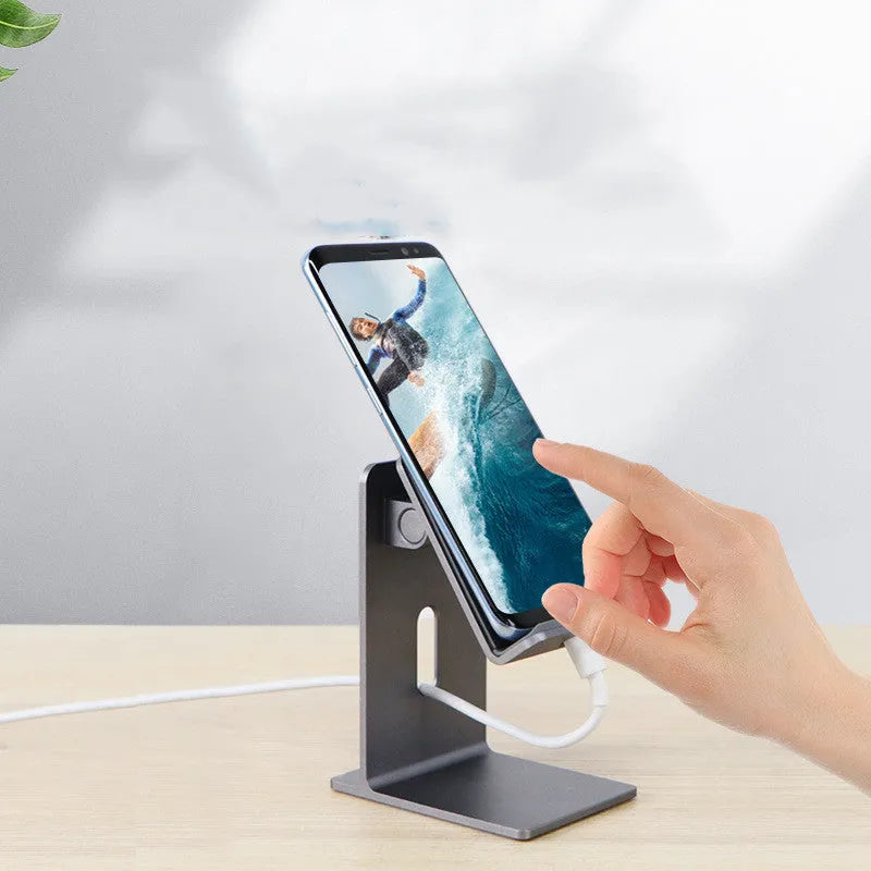 Alloy mobile phone holder on desktop with smartphone inserted, Dark Space Gray colour