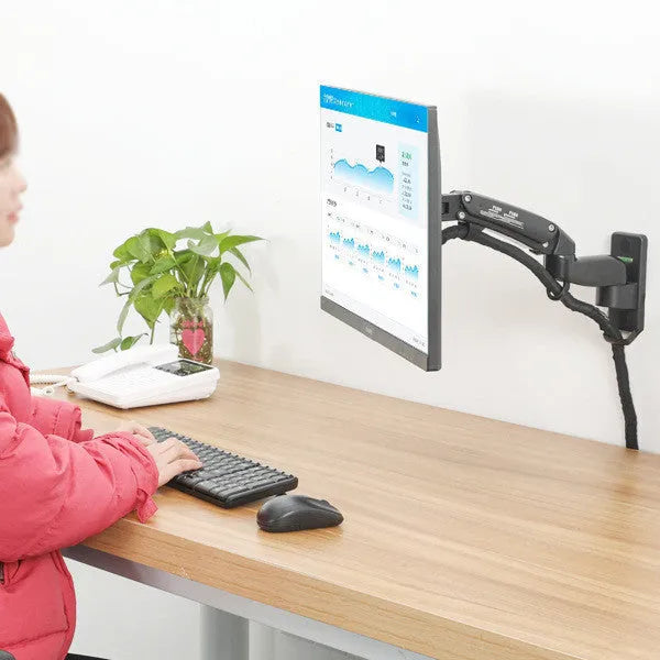 Black wall-mounted monitor arm with adjustable height, extension, and rotation for VESA compatible screens.