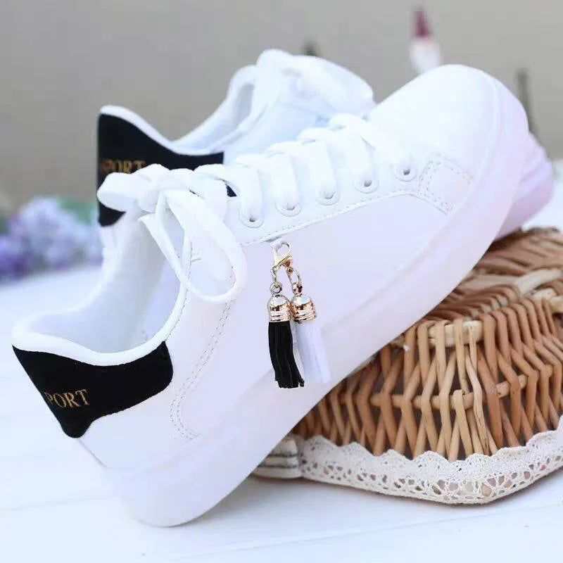 Women's black and pink mesh fashion casual shoes with a flat rubber sole.