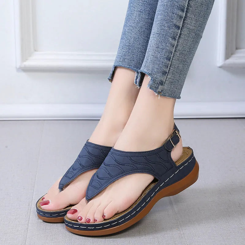 Women's casual wedge heel sandals with adjustable buckle strap in solid red colour