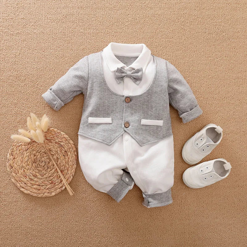 Baby wearing a long-sleeved cotton jumpsuit in a navy blue gentleman style