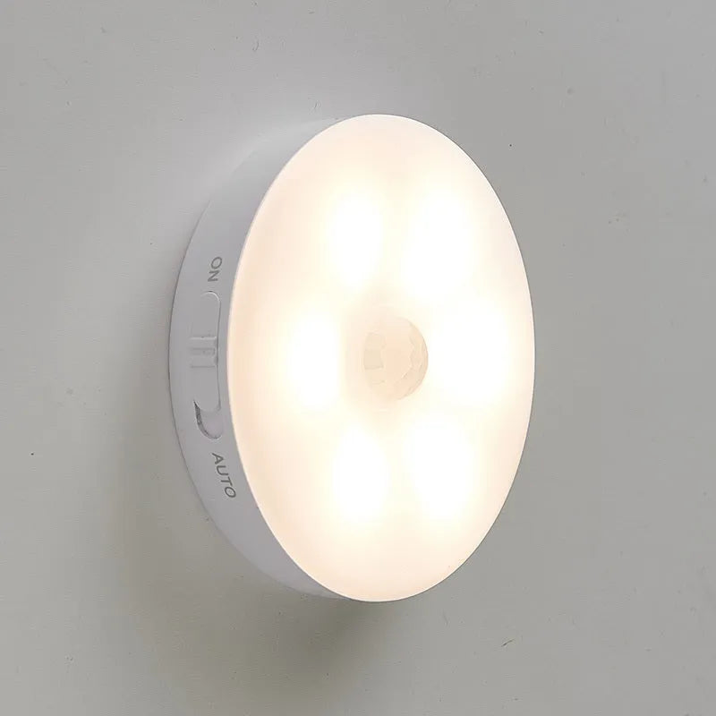 Wireless motion sensing LED light for night-time hallway and cabinet illumination