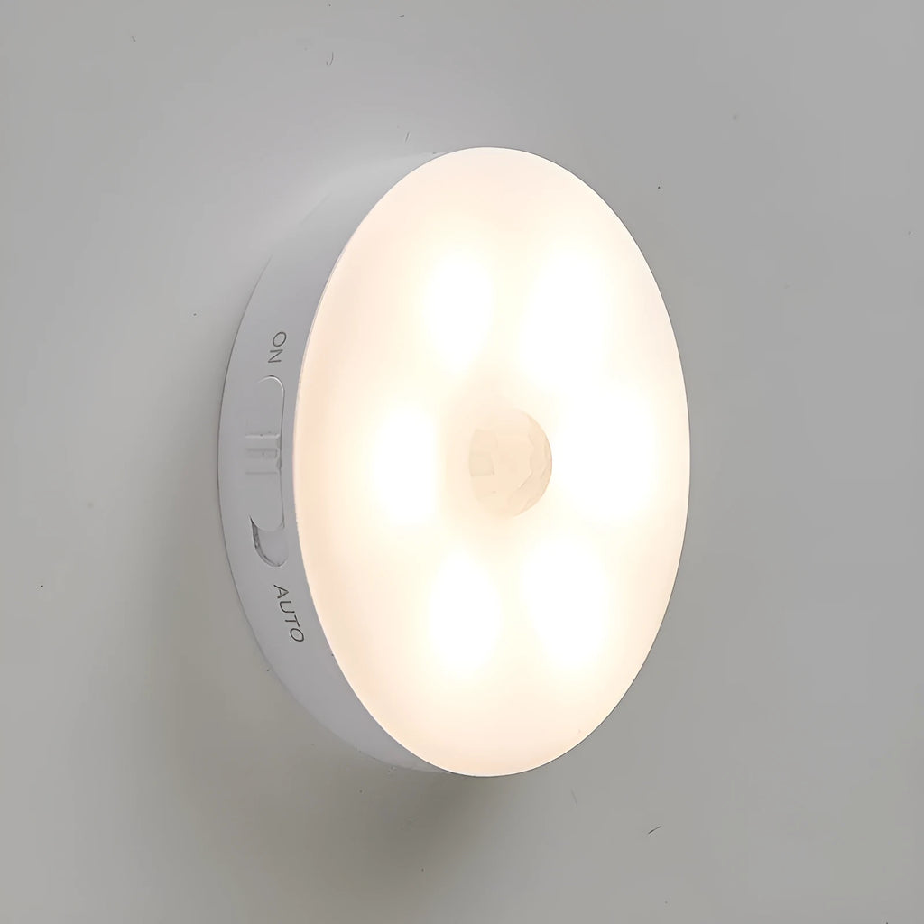 Wireless motion sensing LED light for night-time hallway and cabinet illumination