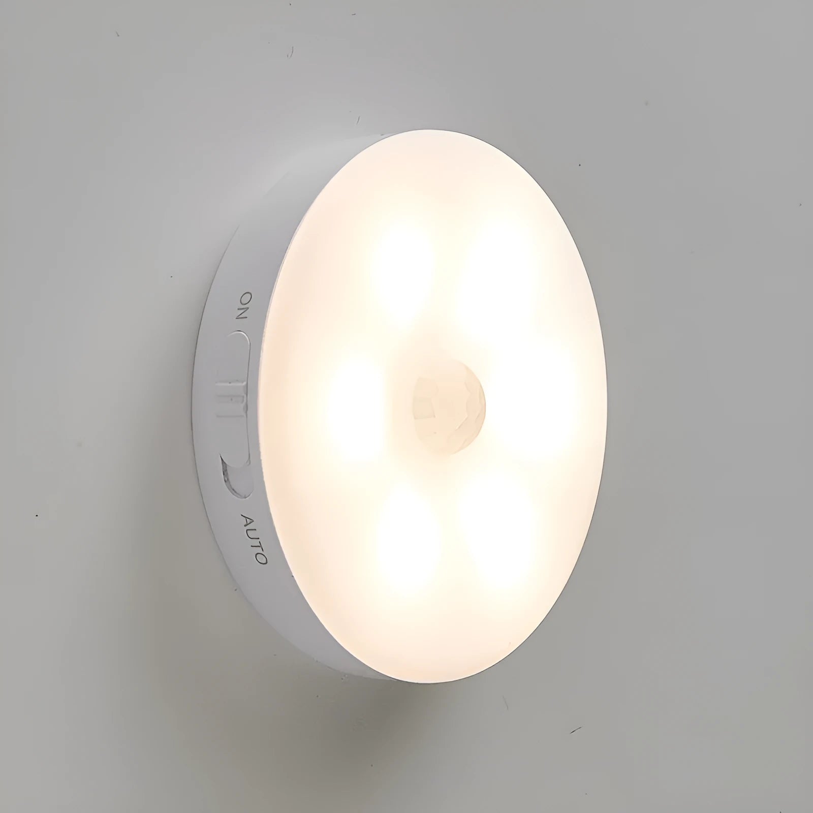 Wireless motion sensing LED light for night-time hallway and cabinet illumination