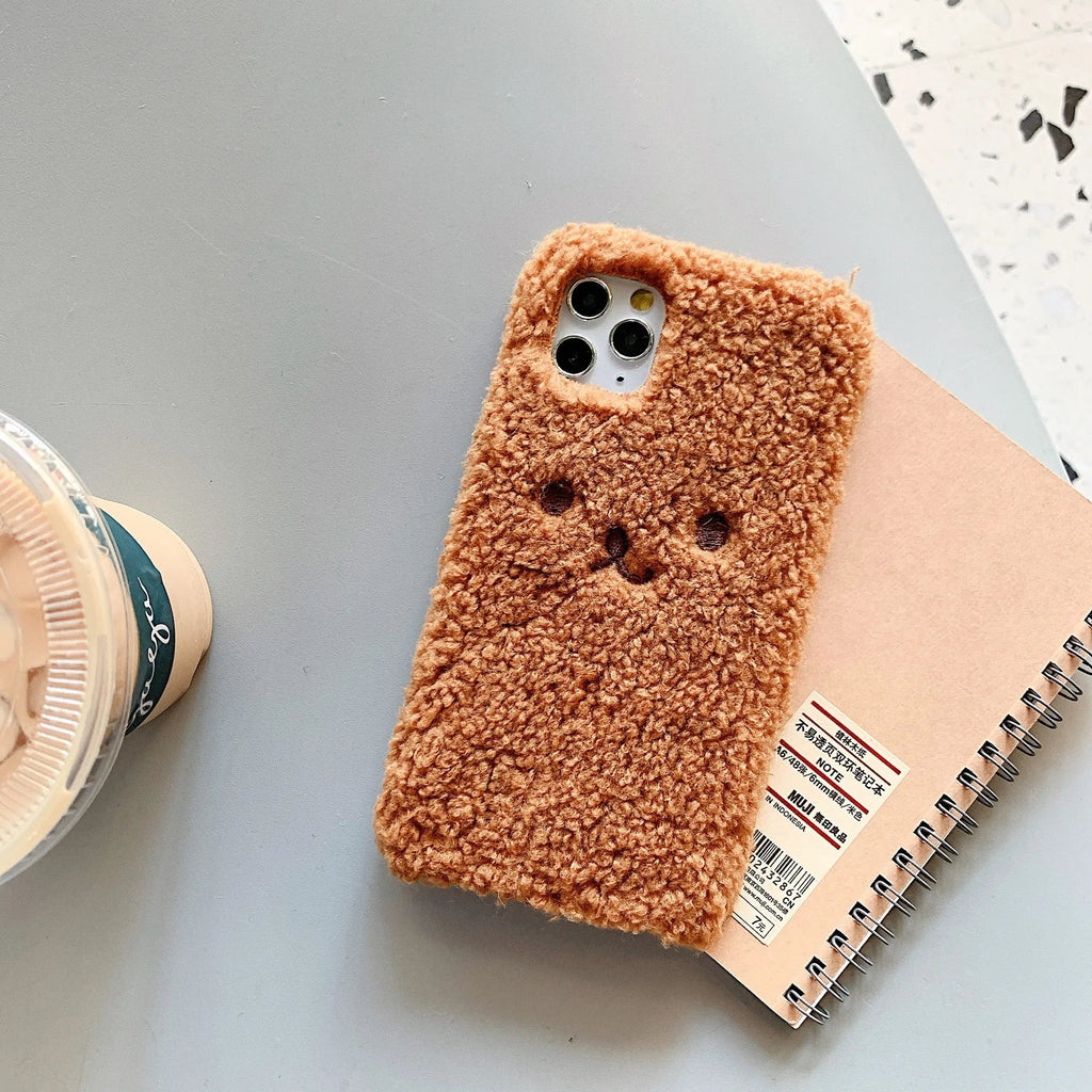 Brown embroidered plush cartoon bear face on a soft TPU iPhone case for iPhone 11.