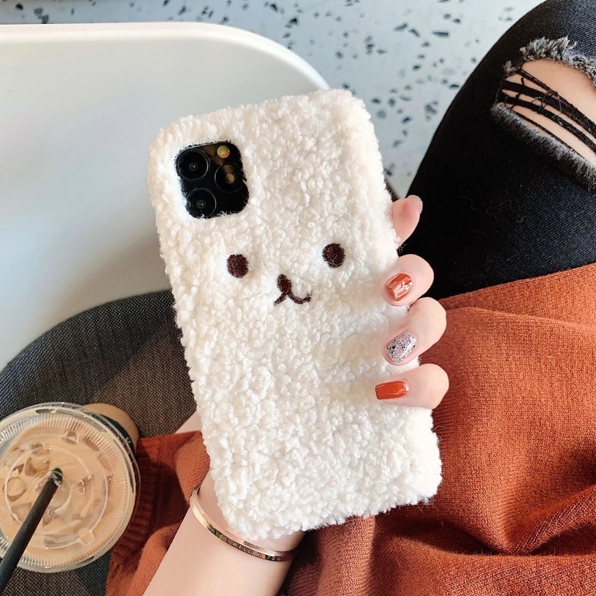 Brown embroidered plush cartoon bear face on a soft TPU iPhone case for iPhone 11.