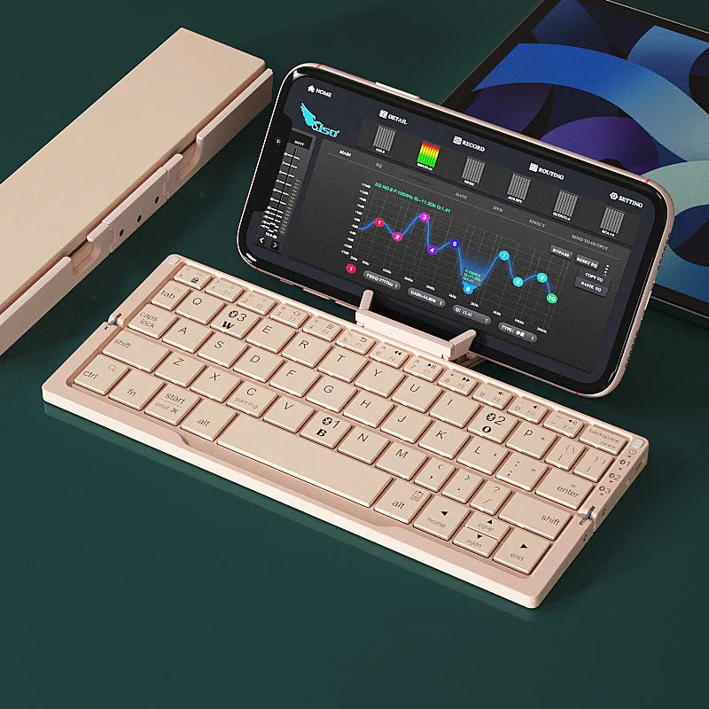Silver white folding Bluetooth keyboard opened with stand supporting tablet