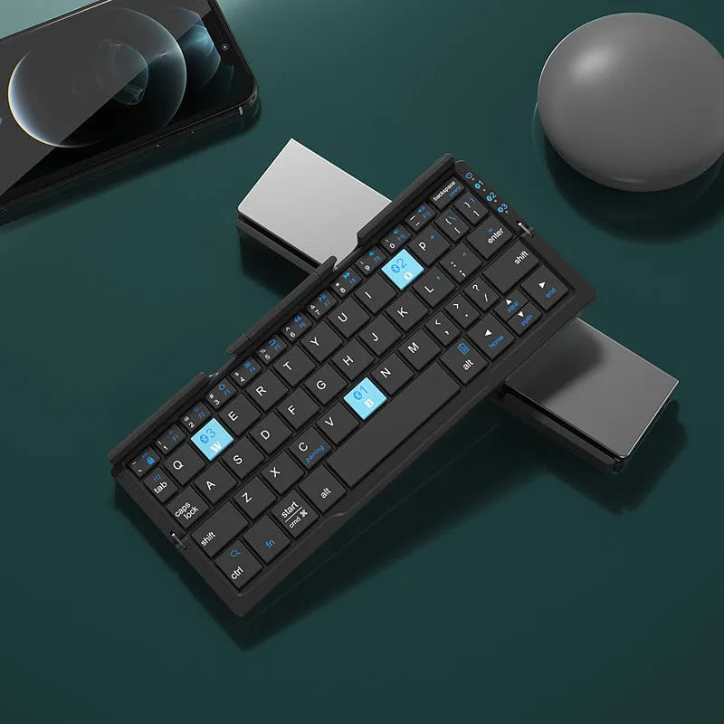Silver white folding Bluetooth keyboard opened with stand supporting tablet
