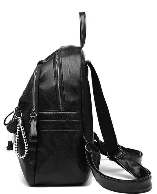 Black PU leather backpack with soft surface showing organised internal compartments and double shoulder straps