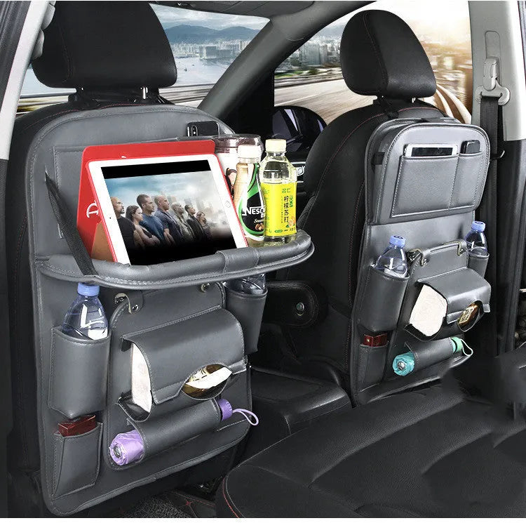 PU leather car seat back storage organiser with multiple pockets hanging behind car headrest