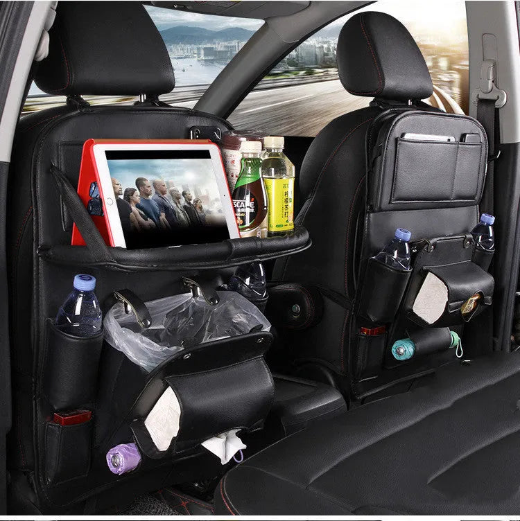 PU leather car seat back storage organiser with multiple pockets hanging behind car headrest