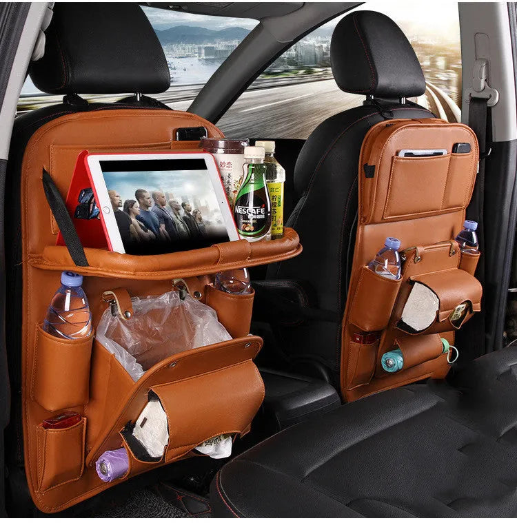 PU leather car seat back storage organiser with multiple pockets hanging behind car headrest