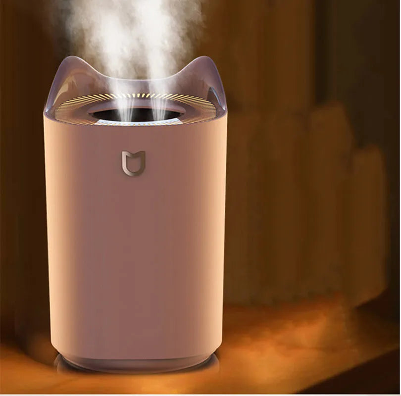 Coral Pink and Glacier White USB double spray humidifier with three mist outlets and large water tank.