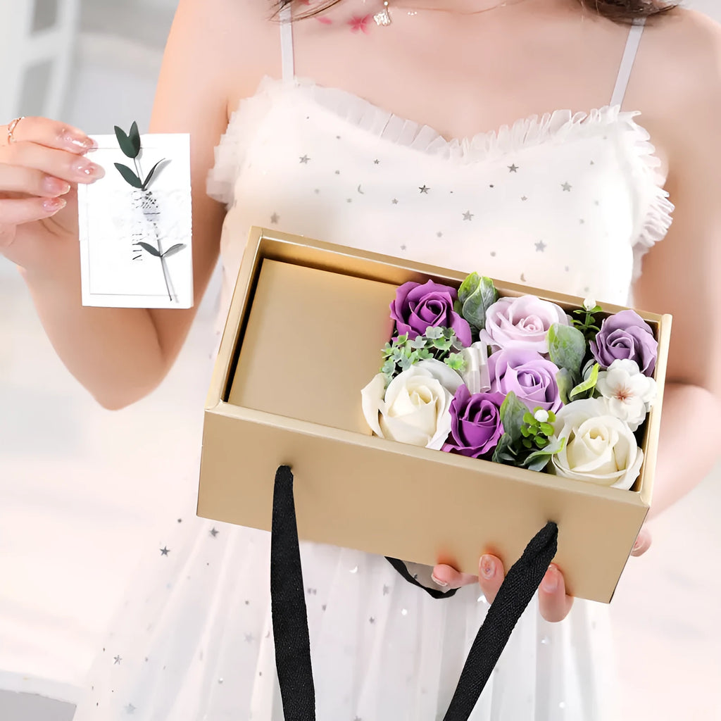 Soap flower rose gift box in golden packaging with greeting card