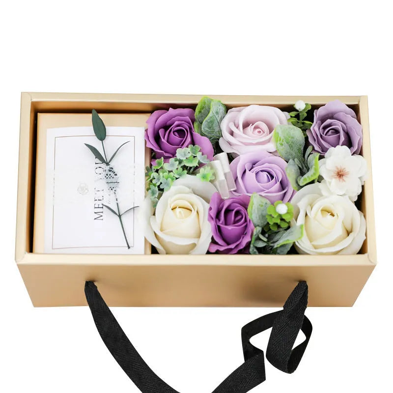 Soap flower rose gift box in golden packaging with greeting card