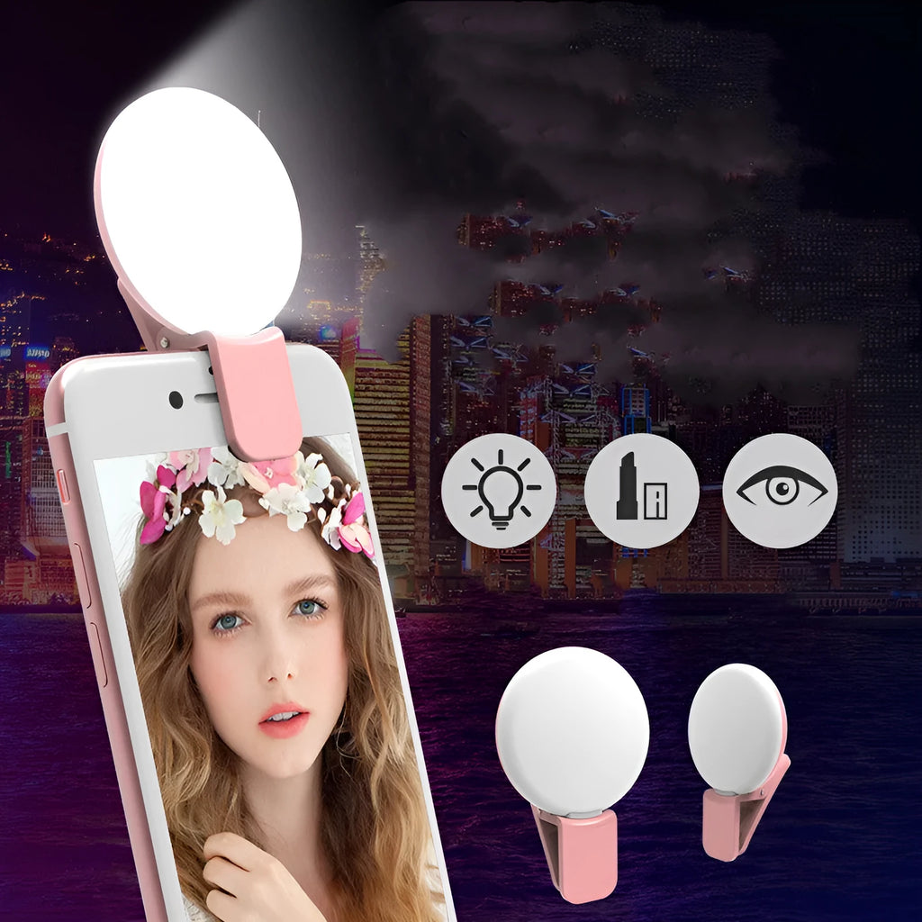 Small round clip-on LED fill light attached to a mobile phone, shown in four colour options.
