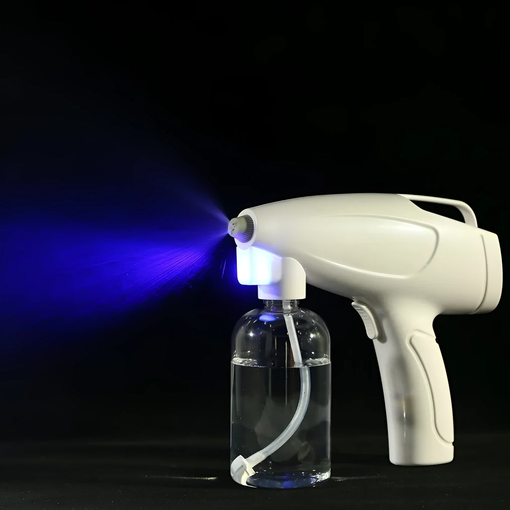 White handheld cordless electric disinfection spray gun with USB-C charging port.