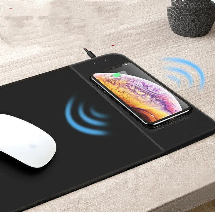Wireless charging mouse pad with cartoon design, RGB lighting, and non-slip rubber base