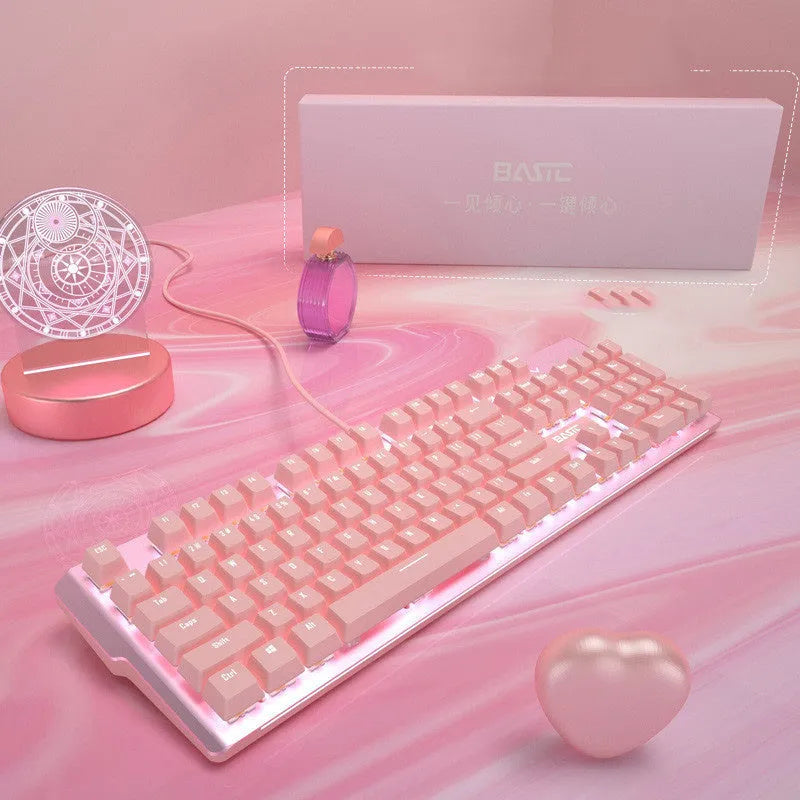 Pink wired mechanical keyboard and gaming mouse set on a desktop, showing green or red switch options.