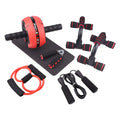 Green resistance band push-up bar and abdominal fitness machine set on a floor for home workout.