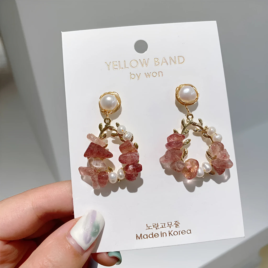 Pink crystal leaf design earrings with silver plated finish on alloy base