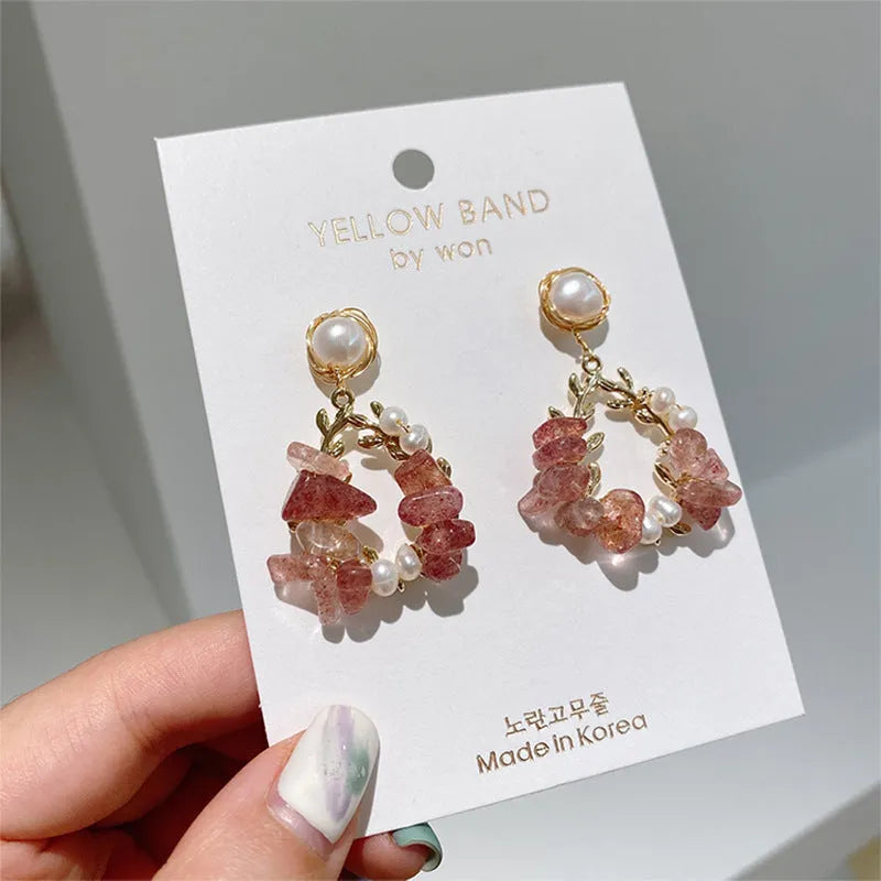 Pink crystal leaf design earrings with silver plated finish on alloy base