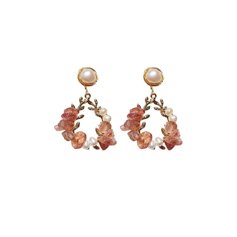 Pink crystal leaf design earrings with silver plated finish on alloy base