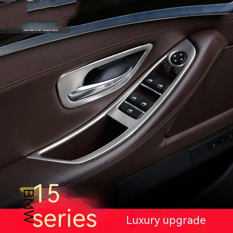 Set of four metallic silver trim strips for BMW 5 Series interior door handles.