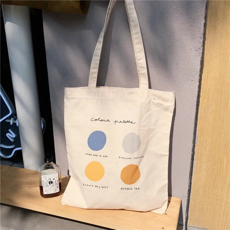 Women's geometric pattern canvas tote bag with zipper closure and shoulder straps in light pink colour