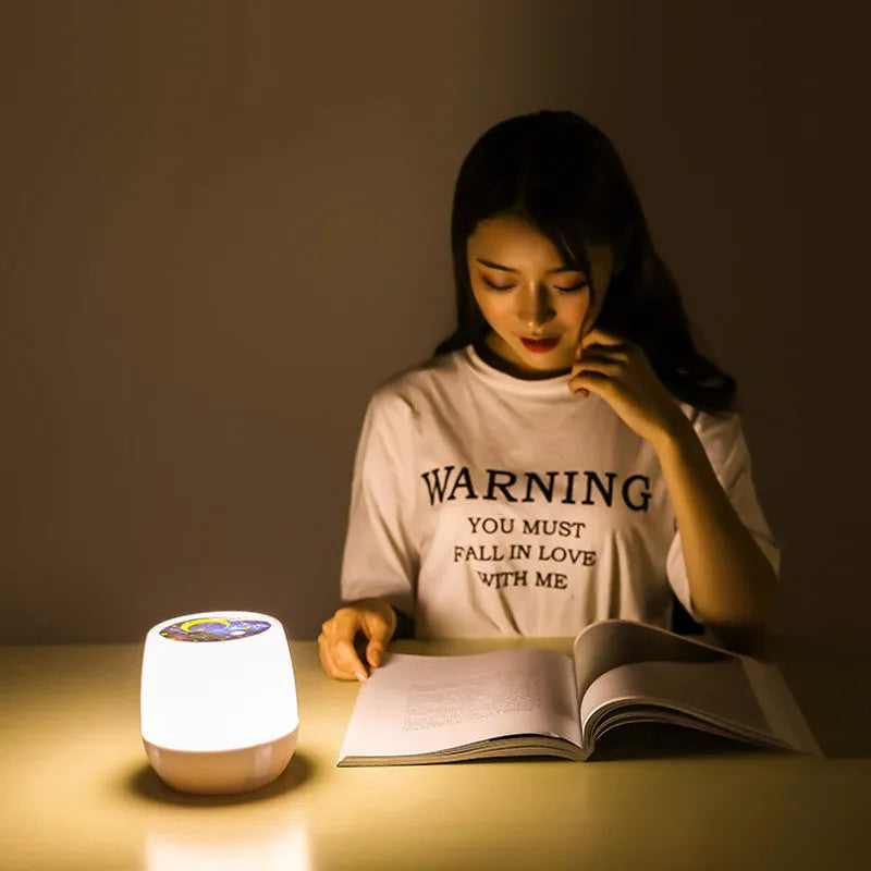 Pruixin rotating projector night light showing star pattern projection on a bedroom wall
