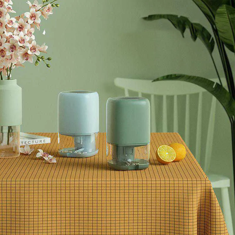 Portable mini dehumidifier in blue, green, or white colours with 0.7 litre water tank