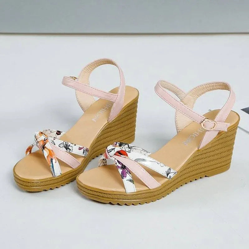 Women's pink wedge sandals with a fish mouth open toe and a thick non-slip heel.