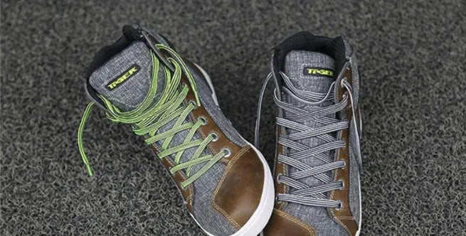 Black motorcycle riding shoes with casual short boot design showing anti-fall protection features