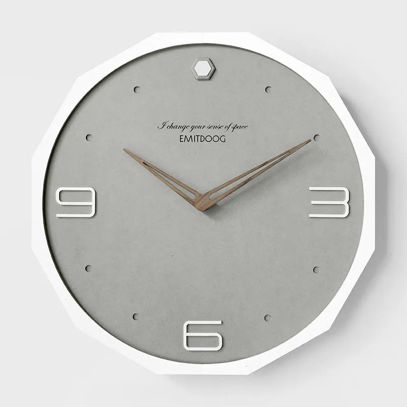 12 inch round Nordic style wall clock with a creative perforated metal face.