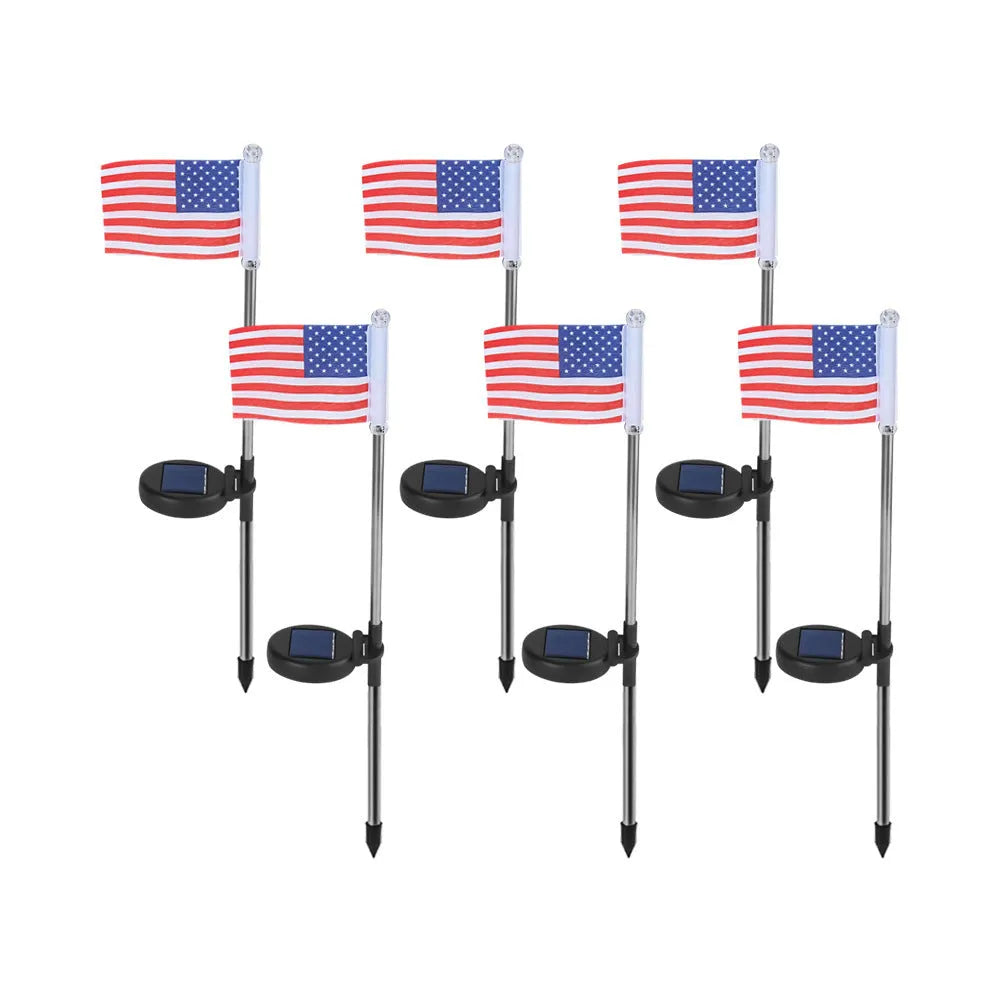 Solar-powered garden flag light showing American flag design on waterproof fabric with stainless steel pole