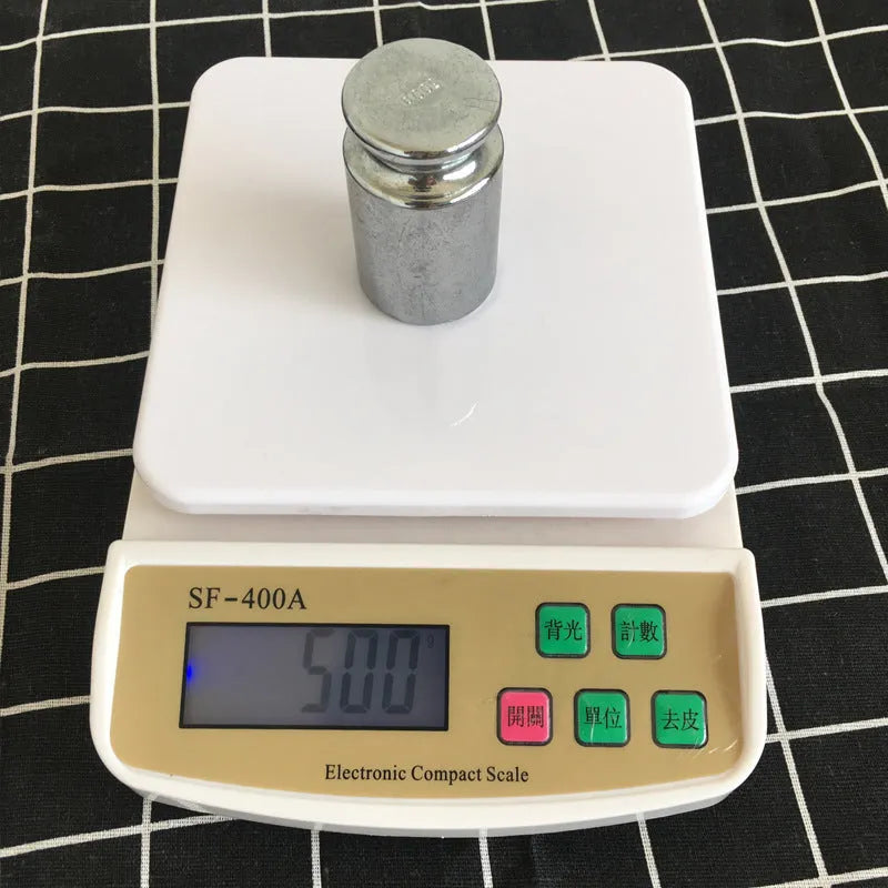 Electronic kitchen scale with digital display showing weight measurement for baking ingredients