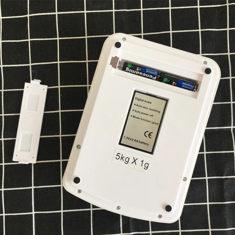Electronic kitchen scale with digital display showing weight measurement for baking ingredients