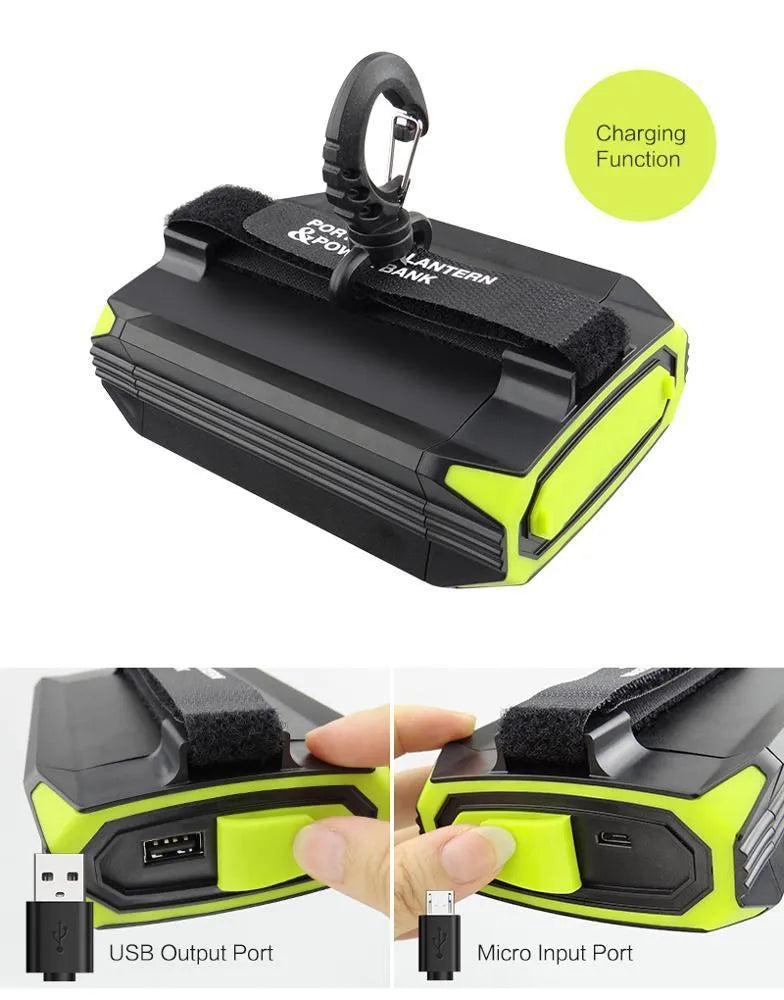 Green aluminium alloy rechargeable camping light with LED array and USB port.