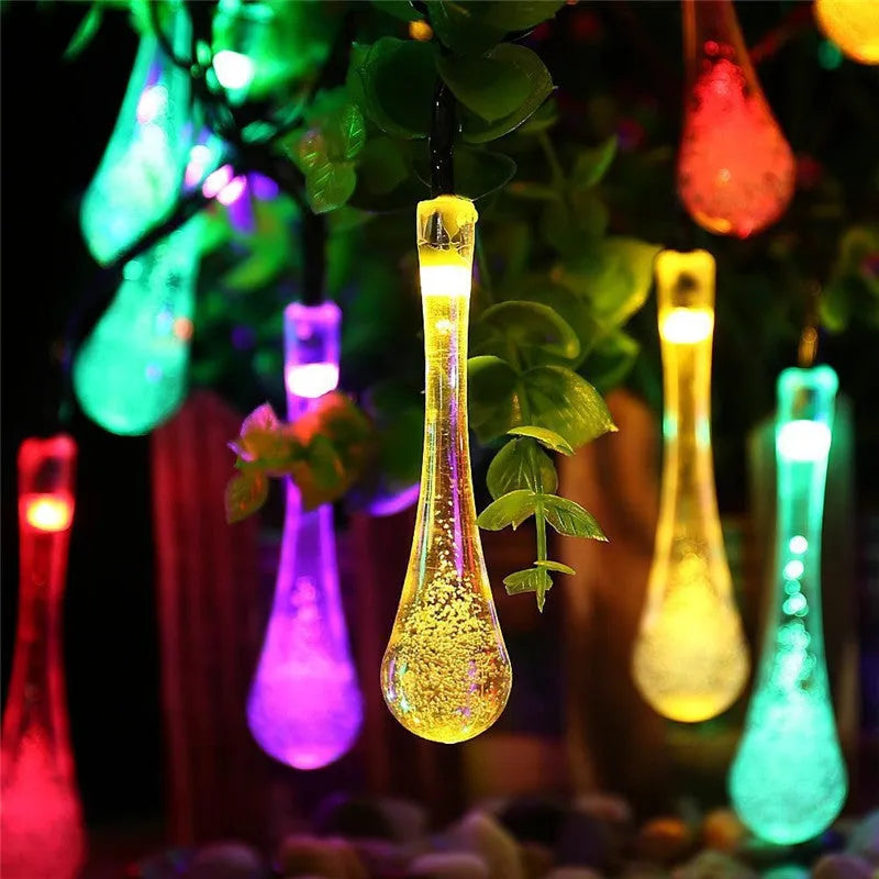 Solar-powered LED outdoor string lights with water drop pendants on a 6.5 metre cable