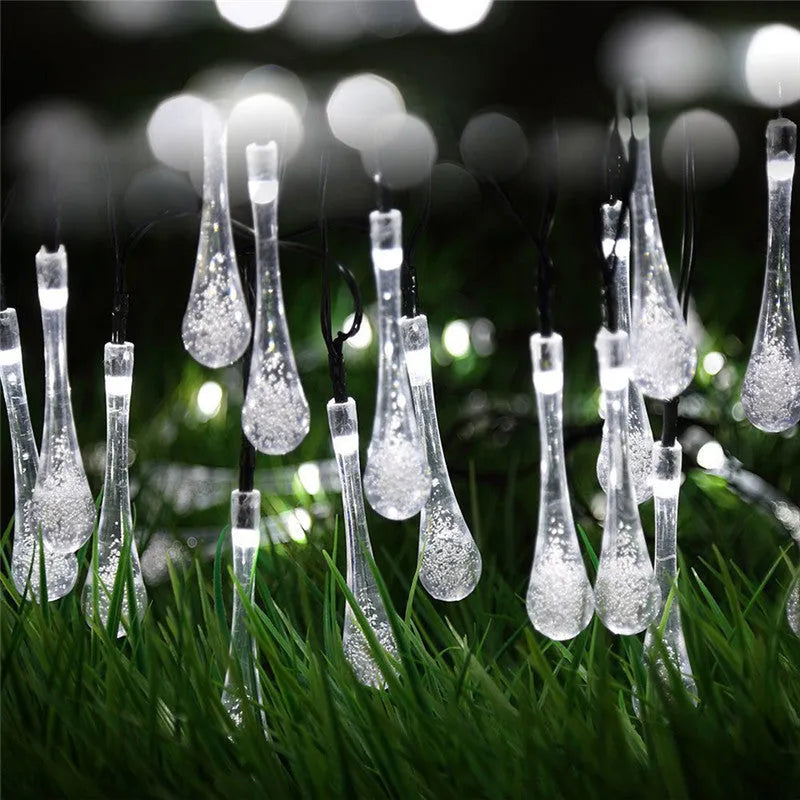 Solar-powered LED outdoor string lights with water drop pendants on a 6.5 metre cable