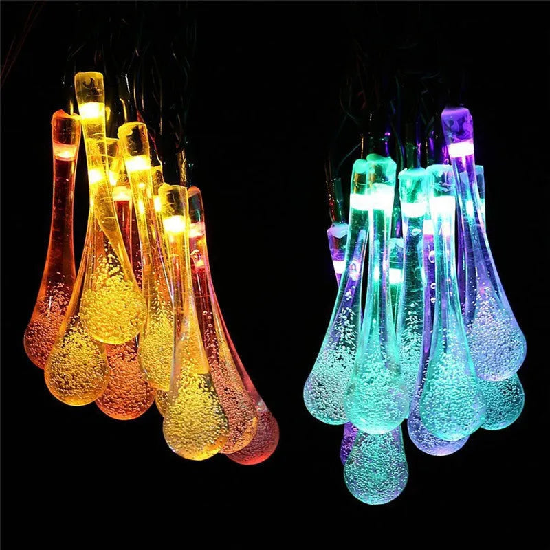 Solar-powered LED outdoor string lights with water drop pendants on a 6.5 metre cable