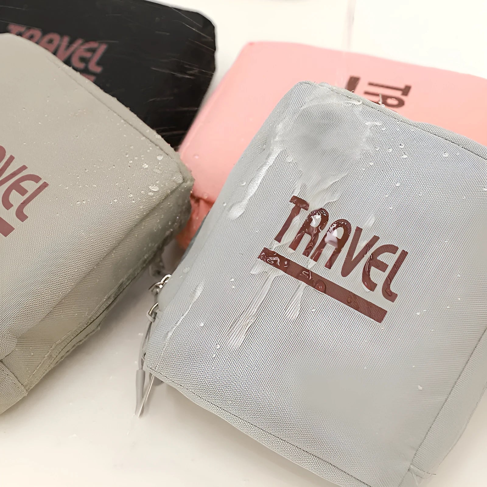 Cube-shaped black travel storage bag made from 300D Oxford cloth with a sealed zip closure.