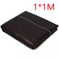 Black plastic weed-proof cloth sheet laid flat on soil for farmland and greenhouse weed suppression.