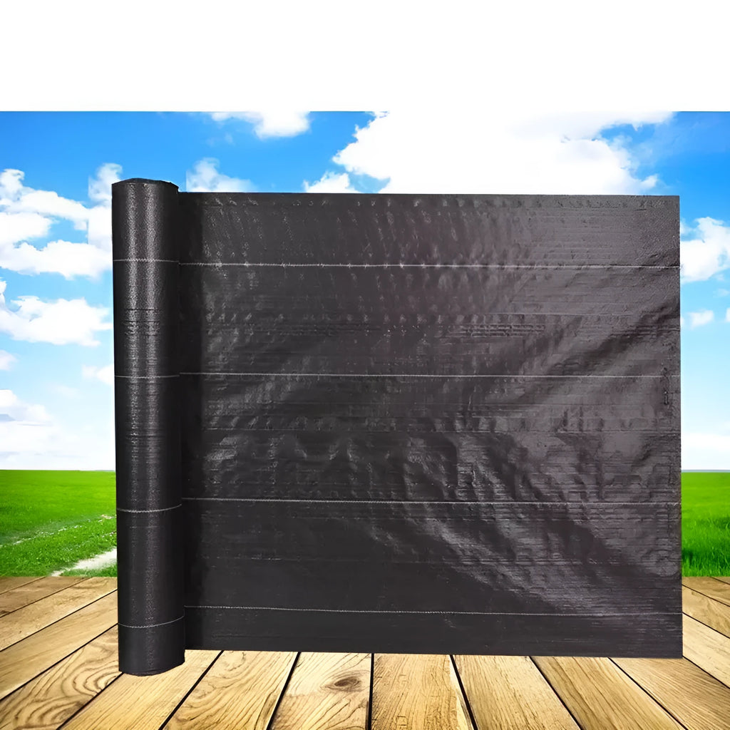 Black plastic weed-proof cloth sheet laid flat on soil for farmland and greenhouse weed suppression.