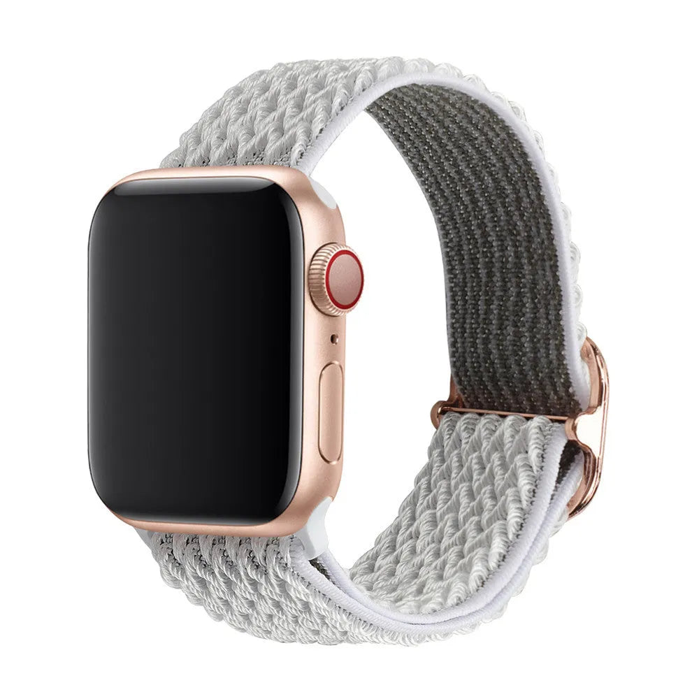 Braided nylon elastic strap for Apple Watch in wave pattern, showing colour options on a wrist.