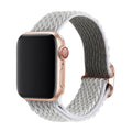 Braided nylon elastic strap for Apple Watch in wave pattern, showing colour options on a wrist.