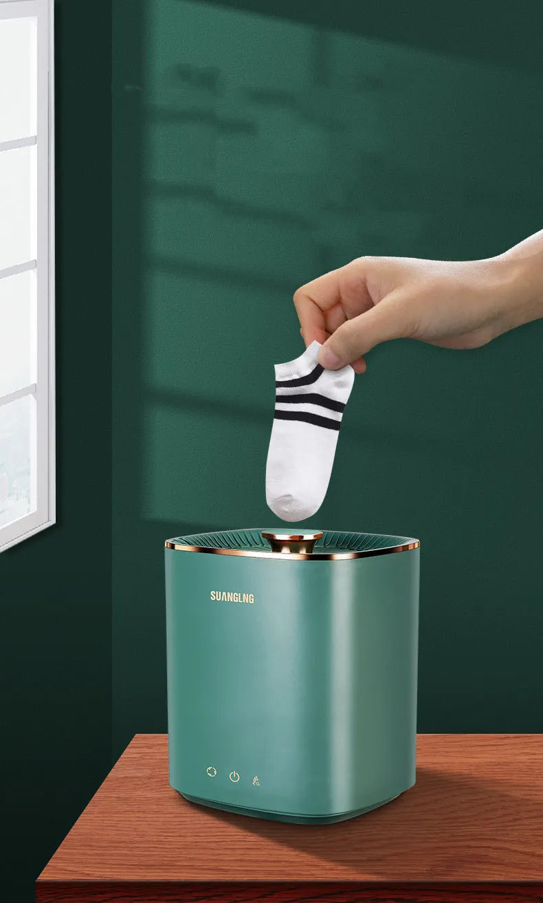 Green or white mini portable automatic washing machine for underwear and socks on a counter.
