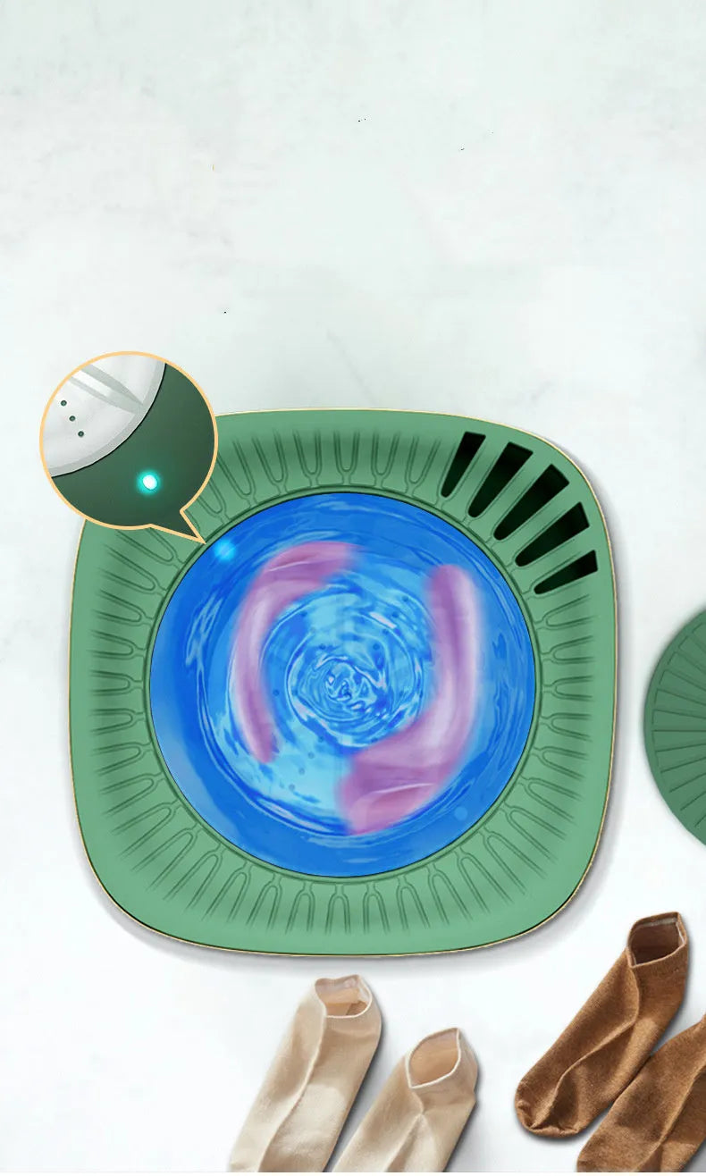 Green or white mini portable automatic washing machine for underwear and socks on a counter.
